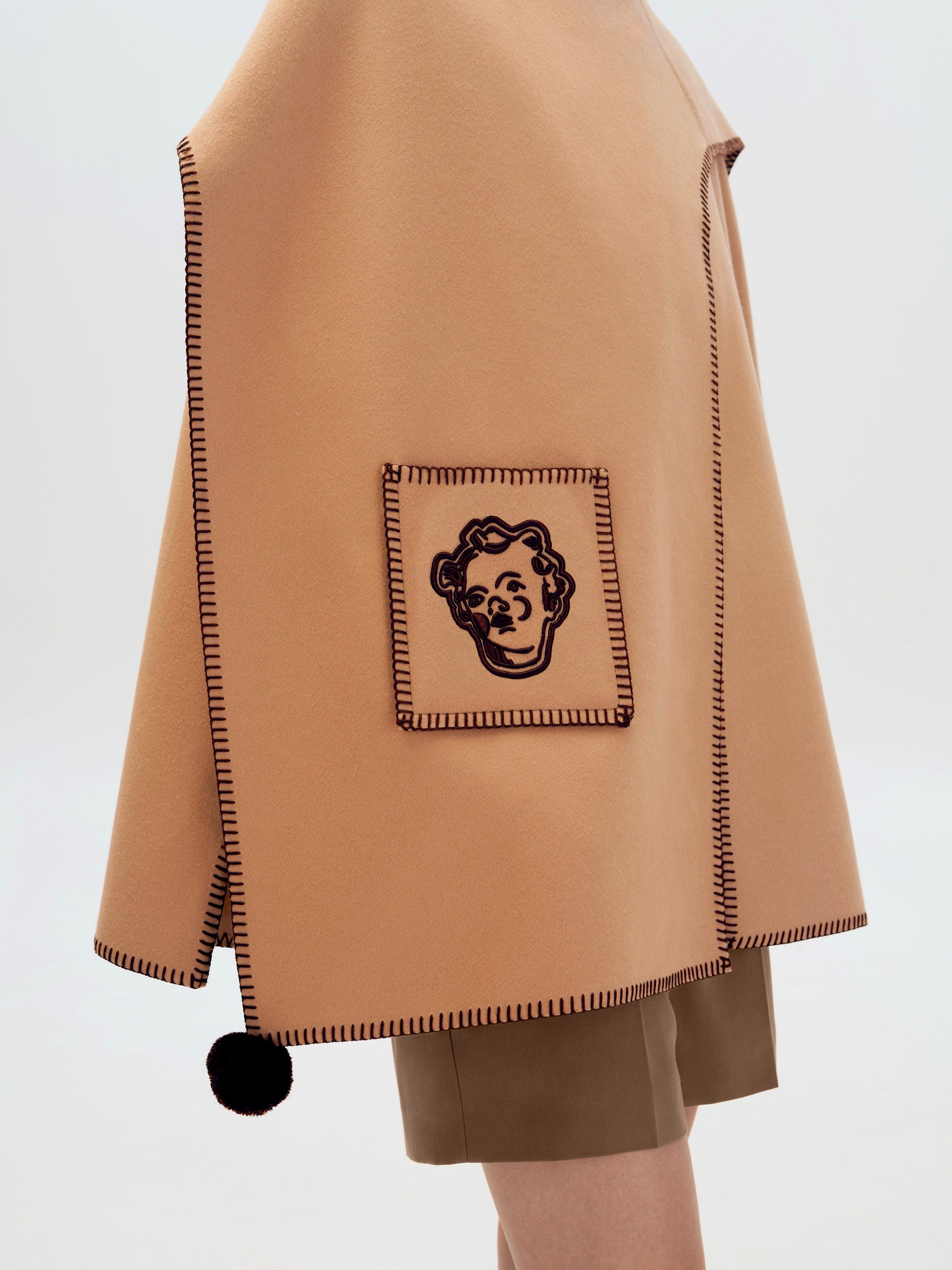 Пончо асиметричне коричневе фото