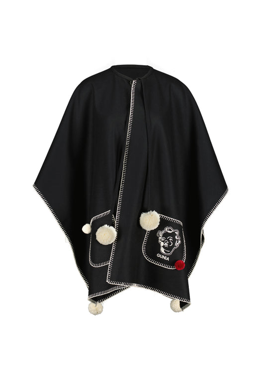 Woollen poncho with pompons